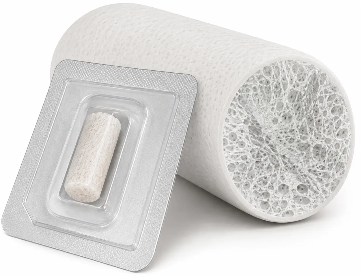 A sterile socket preservation bone graft plug in its peel-open double blister, beside a magnified cutaway showing the open collagen matrix that carries the bone mineral